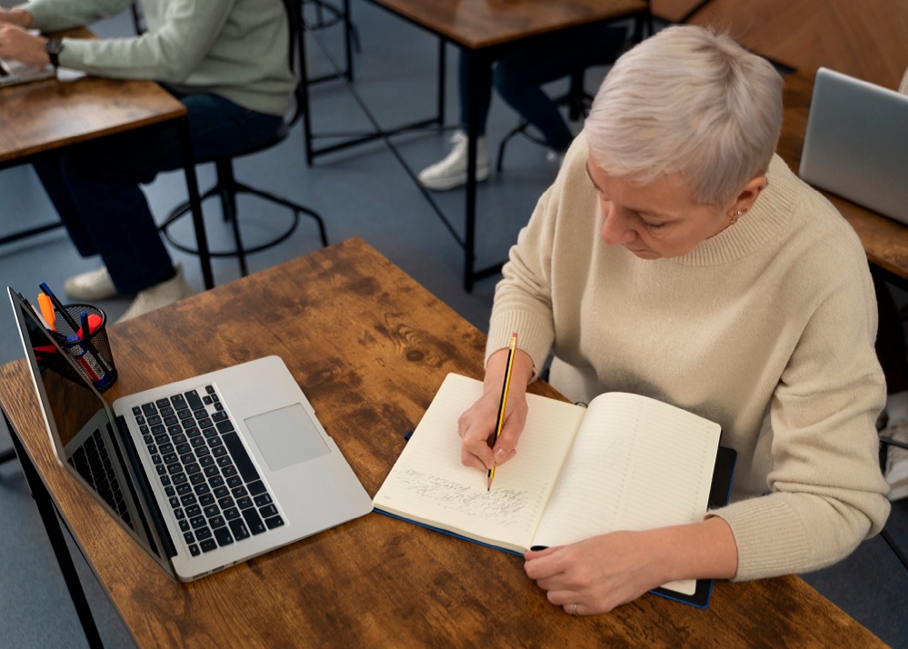 senior-people-in-school-during-class-with-laptop-computer.jpg